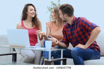 group of students to discuss the problem sitting on the couch.