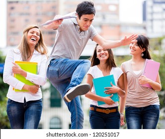 Group Of Students Having Fun Looking At A Man Jumping