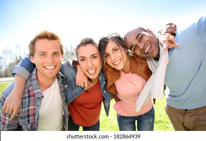 Group Of Students Having Fun Outside College Campus