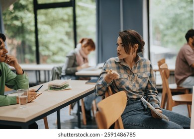 A group of students interacting during a class in a welcoming classroom environment. The image captures a moment of active learning and collaboration.