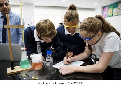 Group Of Students Laboratory Lab In Science Classroom