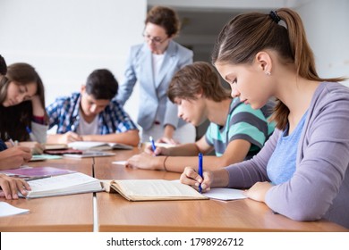 group of students listening to the teacher in the classroom at school - Shutterstock ID 1798926712