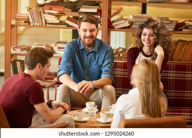 Group of students make break from learning in cafe