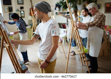 Group Of Students Painting At Art Lessons