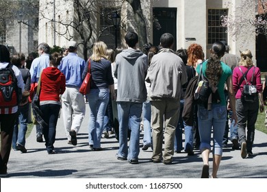 Group Of Students And Parents Taking College Tour