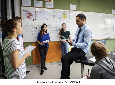 Group of students presentation in classroom - Powered by Shutterstock