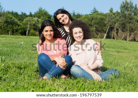 Similar – Happy women looking at camera over garden fence