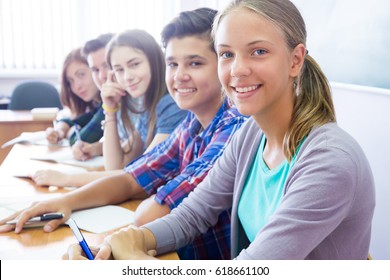 Group Of Students Sitting In The Classroom At School