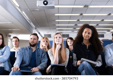 Group Of Students Sitting In Lecture Hall