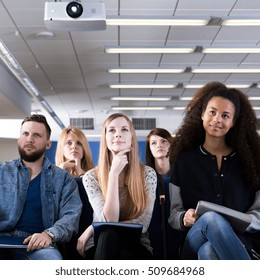 Group Of Students Sitting In Lecture Hall