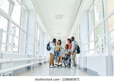 Group of students standing at corridor during break - Powered by Shutterstock