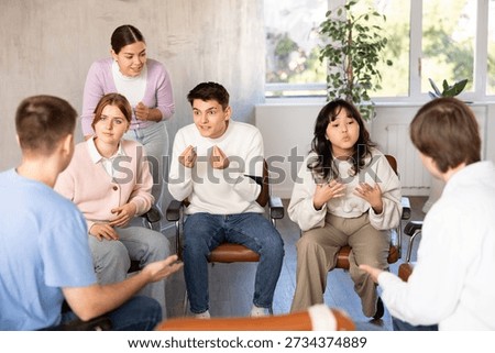 Group of students studying for difficult test in studygroup together