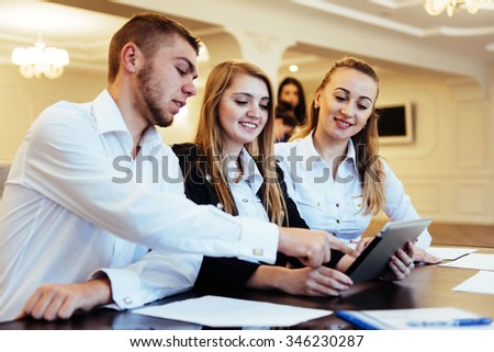 Group of students studying using a laptop