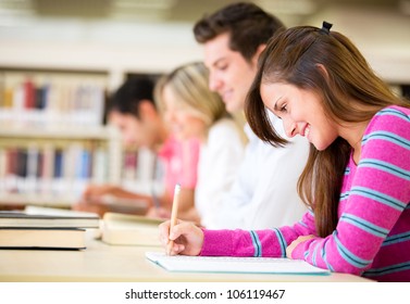 Group of students taking a test at the university