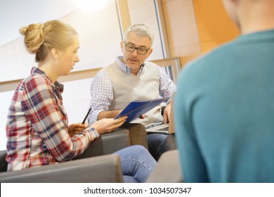 Group Of Students With Teacher In Lounge Room