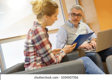 Group Of Students With Teacher In Lounge Room