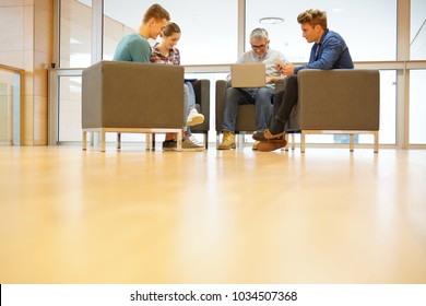 Group Of Students With Teacher In Lounge Room