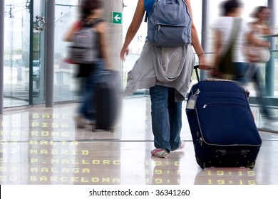 Group Of Students Walking In The Airport Terminal