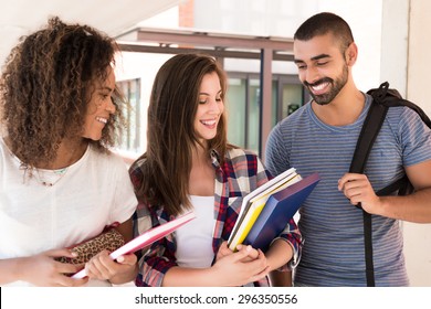 Group Of Students Walking In University Campus