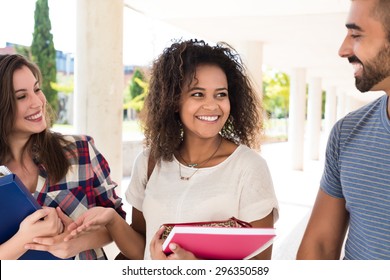 Group Of Students Walking In University Campus