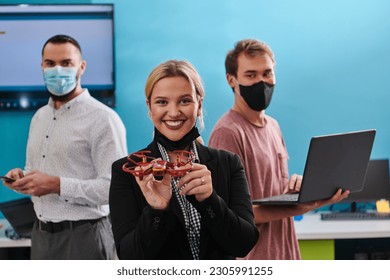  A group of students working together in a laboratory, dedicated to exploring the aerodynamic capabilities of a drone - Powered by Shutterstock