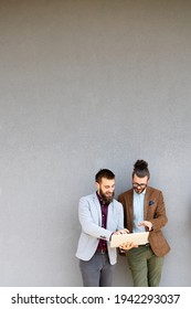 Group Of Success Business People Discussing Ideas At Meeting Outside