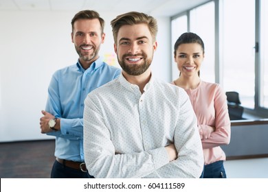 Group Of Successful Business People Standing Together At Office