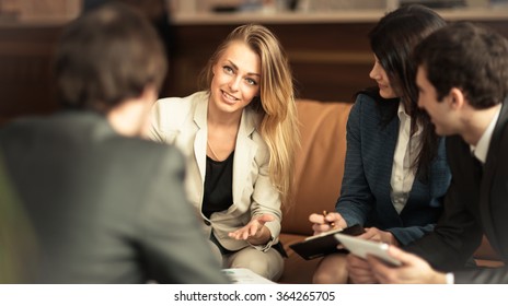 A group of successful businessmen. Discussion of the important contract of the company. - Powered by Shutterstock