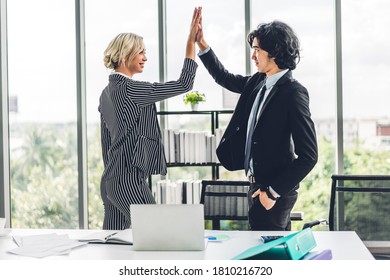 Group Of Successful People Giving Hi Five Together