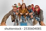 Group of super emotional and excited people pushing shopping cart forward with craziness. Competition for best deals. Concept of Black Friday, Cyber Monday, shopping