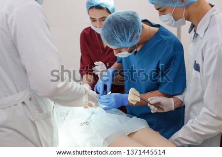 a group of surgeons doing operations in a hospital