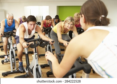 Group Taking Part In Spinning Class In Gym - Powered by Shutterstock