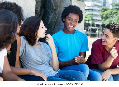 Group Of Talking African American And Latin And Caucasian People