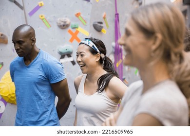 Group talking at climbing wall - Powered by Shutterstock