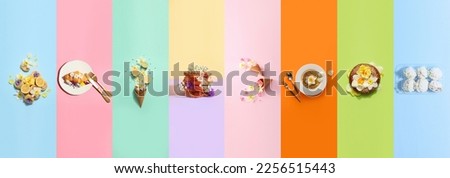 Group of tasty food with fresh flowers on color background
