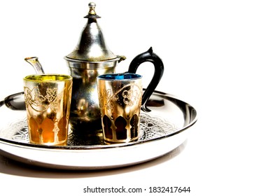 Group of teapot and glasses of oriental tea on a tray on white background - Shutterstock ID 1832417644