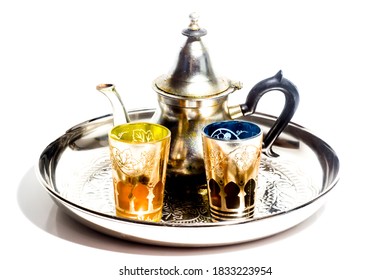 Group of teapot and glasses of oriental tea on a tray on white background - Shutterstock ID 1833223954