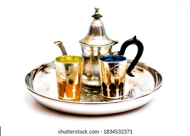 Group of teapot and glasses of oriental tea on a tray on white background - Shutterstock ID 1834532371