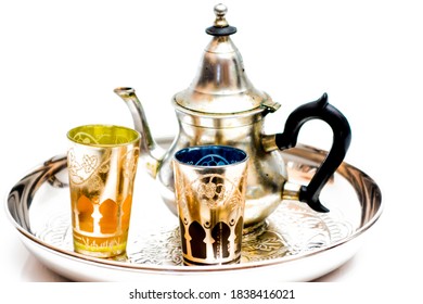 Group of teapot and glasses of oriental tea on a tray on white background - Shutterstock ID 1838416021