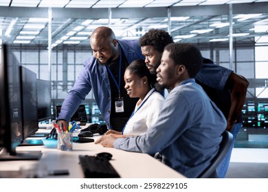 Group of technicians doing brainstorming, reconfiguring server farm to optimize it for data processing requirements. Employees working together to ensure data center equipment operates efficiently