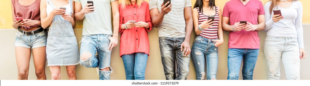 Group of teen friends watching smart mobile phones - Millennials generation addiction to new technology trends - Concept of youth, tech, social and friendship - Main focus on center hands 