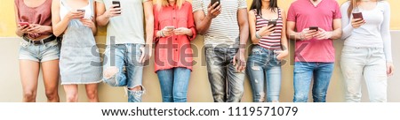 Group of teen friends watching smart mobile phones - Millennials generation addiction to new technology trends - Concept of youth, tech, social and friendship - Main focus on center hands 