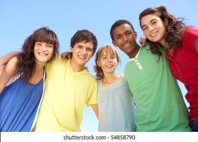 Group Of Teenage Friends Standing Outside