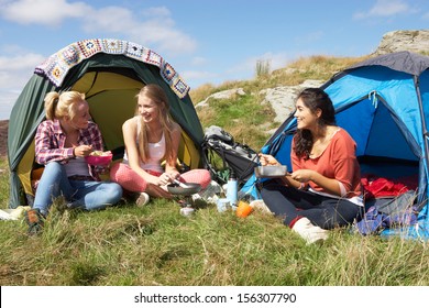 Group Of Teenage Girls On Camping Trip In Countryside