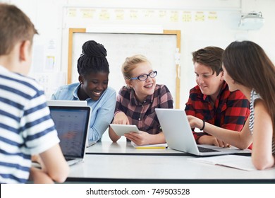 Group Of Teenage Students Collaborating On Project In IT Class - Shutterstock ID 749503528