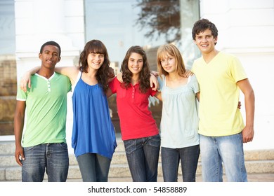 Group Of Teenage Students Standing Outside College Building