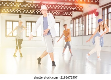 Group of teenagers dancing shuffle and swing dances