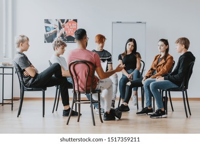 Group of teenagers discussing in a circle on a group therapy - Powered by Shutterstock