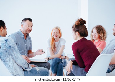 Group of teenagers during psychotherapy with professional counselor