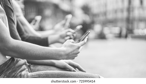 Group Of Teenagers Friends Watching Mobile Phones In City - Young People Addiction To Technology Trends - Alienation Moment For New Generation Problem - Focus On First Hand - Vintage Retro Filter 